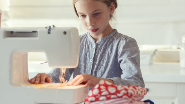 teen at sewing machine