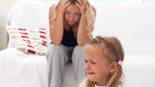 child having tantrum; frustrated mom