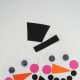 Now cut five tiny circles from black cardstock to create the mouth. Create a smile using the small circles then glue on the plate below the pink cheeks.
