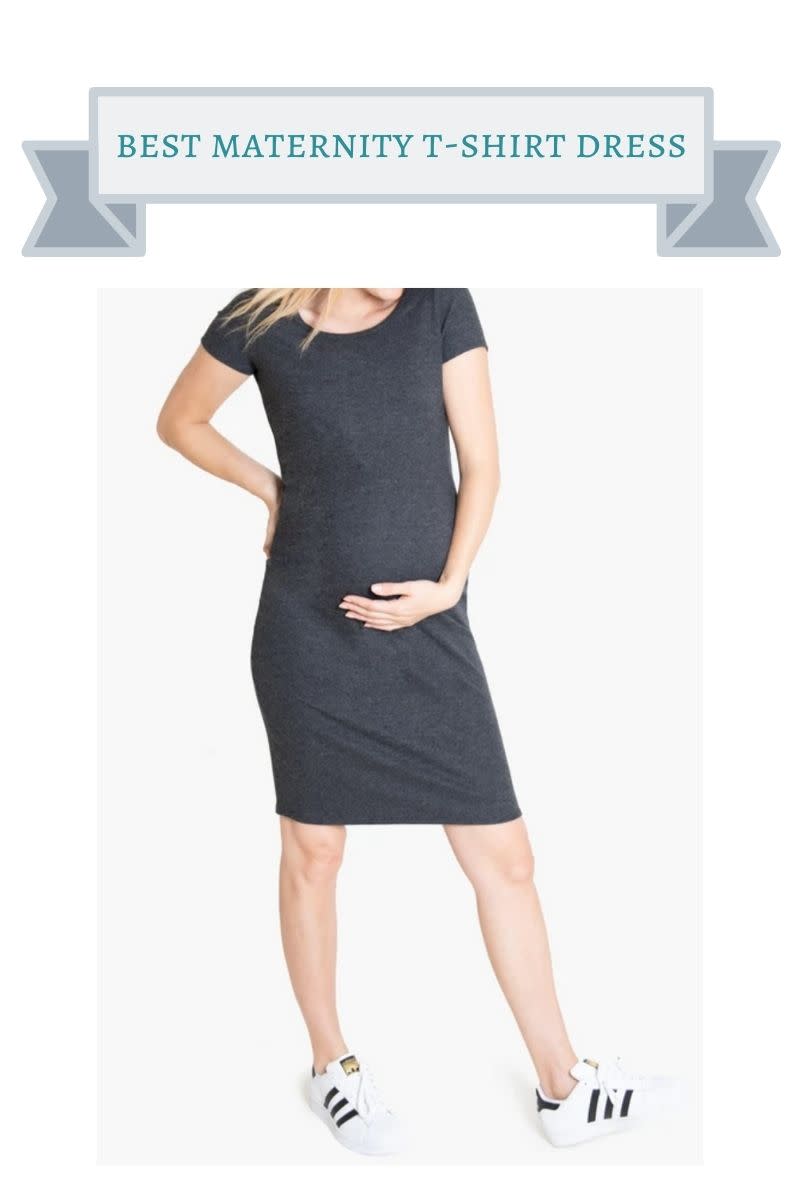 blond haired pregant woman wearing dark gray t-shirt dress with black and white stripe sneakers
