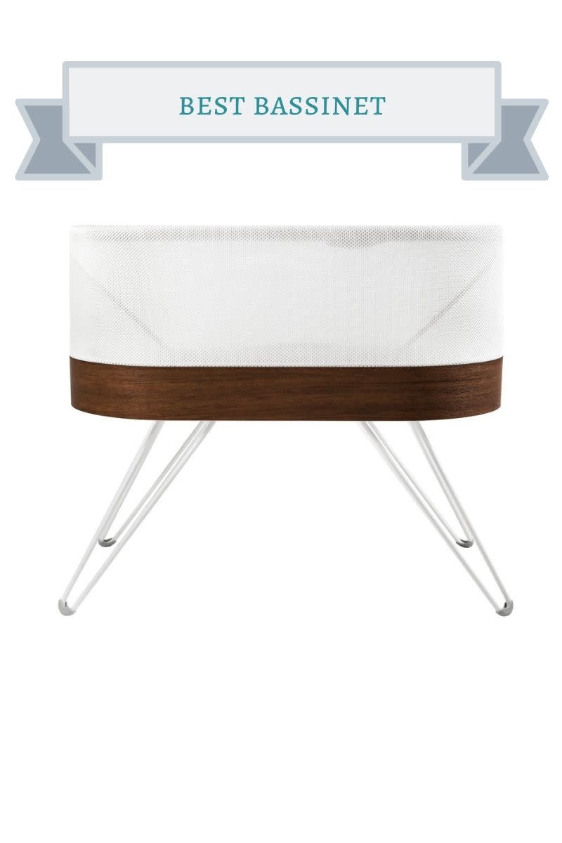 white and brown oval shaped bassinet
