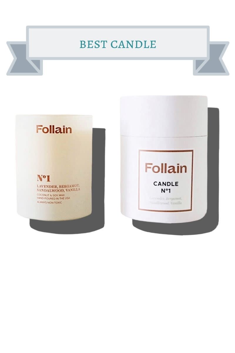 2 off white and white Follain Candle No. 1 with brown and black writing
