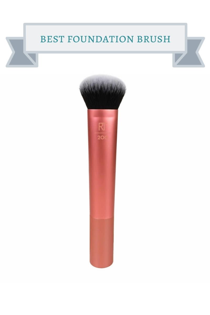 copper colored foundation makeup brush with black bristles witih white tips