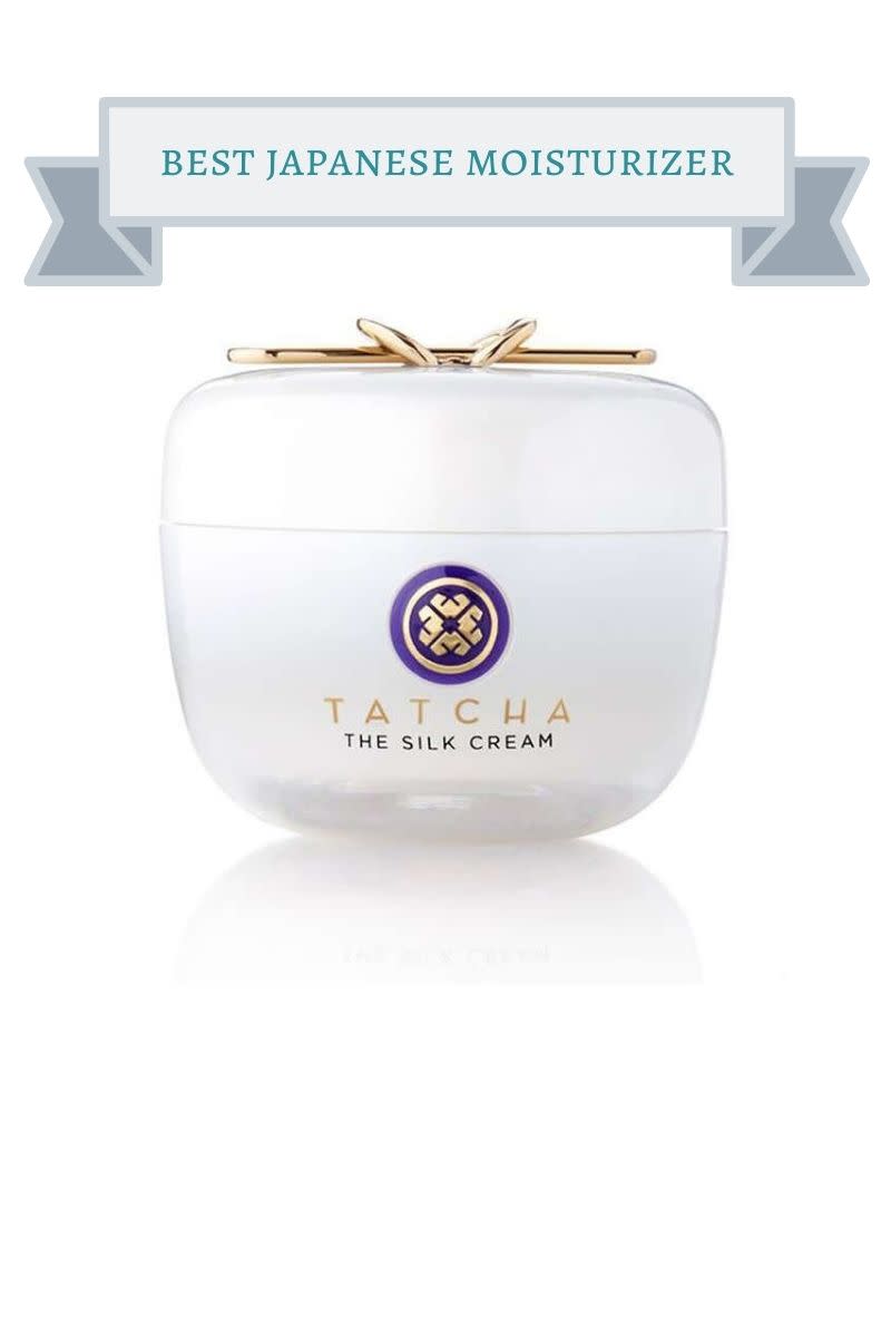 white jar of Tatcha moisturizer with gold handle and purple and gold geometric shape