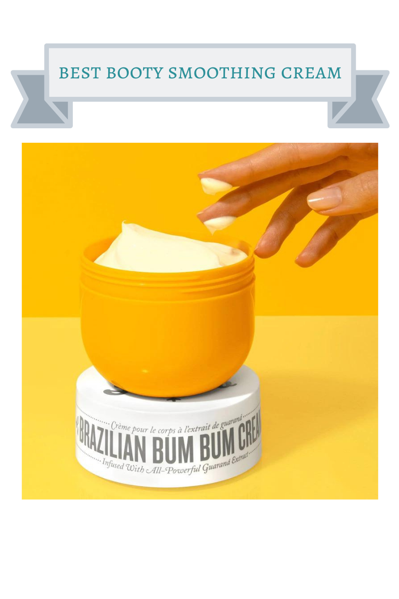 yellow jar of brazilian bum bum cream with hand sticking fingers in it and white lid