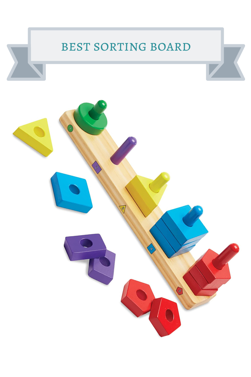 stacking toy with red, yellow, green, blue and purple shapes stacked on wooden pegs on top rectagnular wooden board