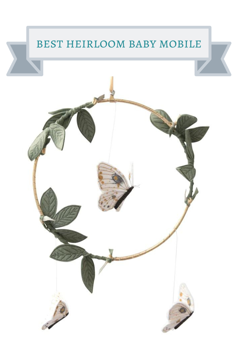 round hoop mobile with green leaves and three white butterflies
