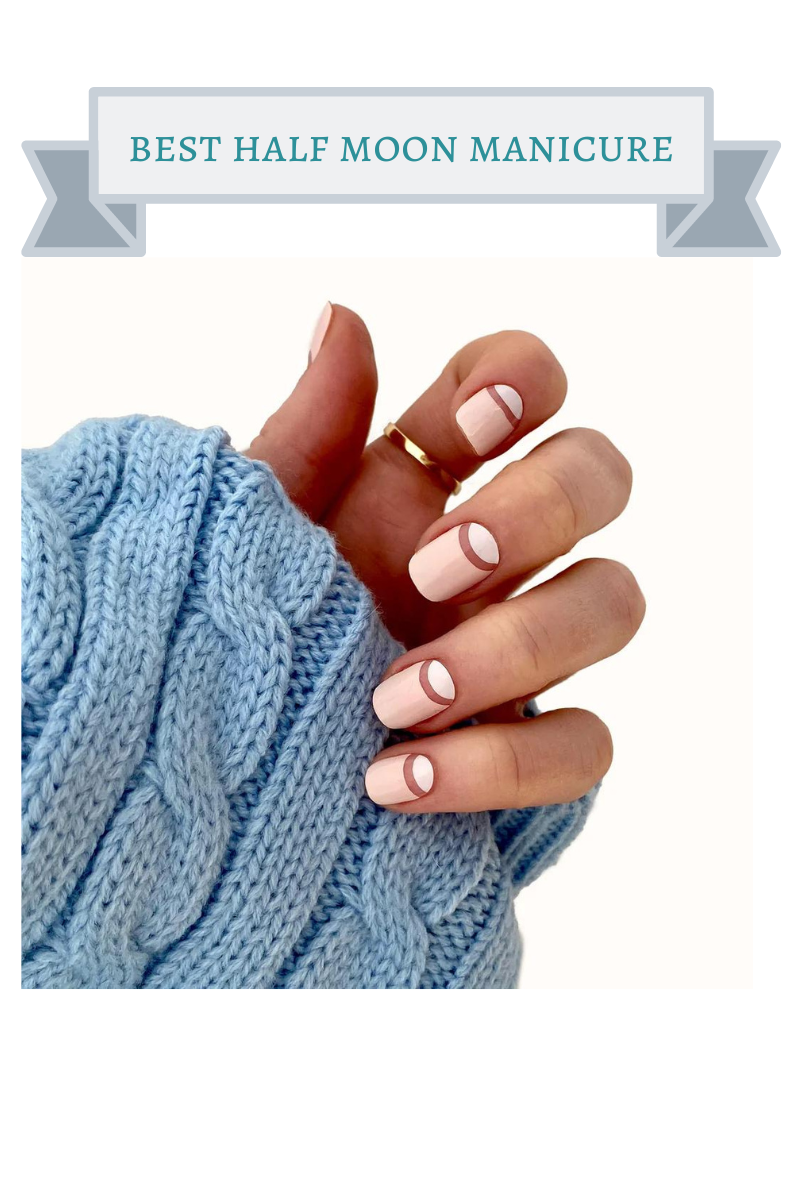 light blue sweater sleeve with blush colored half moon shape manicured nails