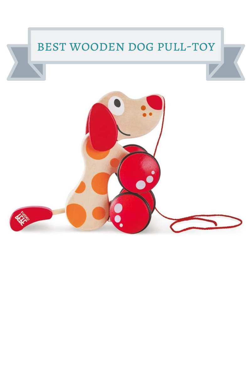 brown spotted wooden dog pull toy with red nose, ears and feet