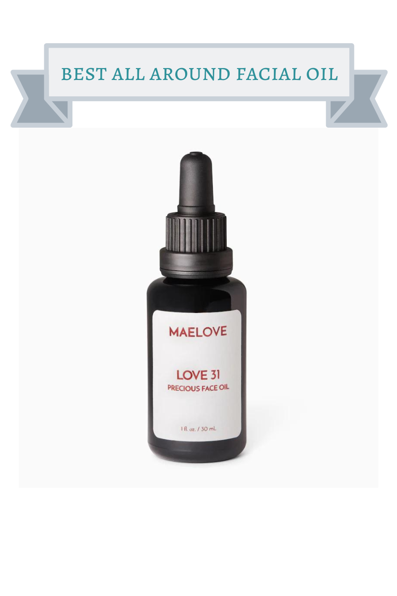 black bottle of maelove love 31 facial oil with white label and rose gold type